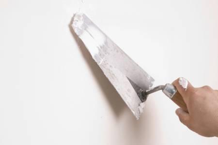 Drywall repair and patching before painting